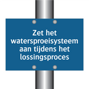 Zet het watersproeisysteem aan tijdens het lossingsproces