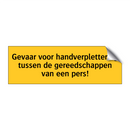 Gevaar voor handverplettering tussen de gereedschappen /.../