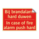 Bij brandalarm hard duwen - In case of fire alarm push hard