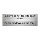 Gelieve op het toilet te gaan zitten - Please sit down on the toilet