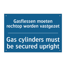 Gasflessen moeten rechtop worden /.../ - Gas cylinders must be secured /.../