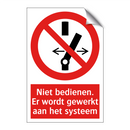Niet bedienen. Er wordt gewerkt aan het systeem