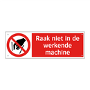 Raak niet in de werkende machine