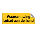 Waarschuwing Letsel aan de hand