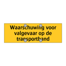 Waarschuwing voor valgevaar op de transportband
