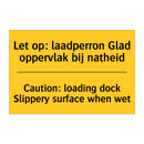 Let op: laadperron Glad oppervlak bij natheid - Caution: loading dock Slippery surface when wet