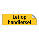 Let op handletsel