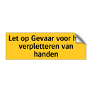 Let op Gevaar voor het verpletteren van handen
