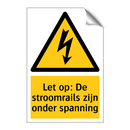 Let op: De stroomrails zijn onder spanning