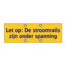 Let op: De stroomrails zijn onder spanning