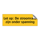 Let op: De stroomrails zijn onder spanning