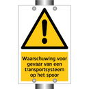 Waarschuwing voor gevaar van een transportsysteem op het spoor