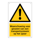 Waarschuwing voor gevaren van een transportsysteem op het spoor