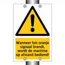 Wanneer het oranje signaal brandt, wordt de machine op afstand bediend!