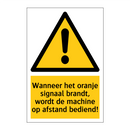 Wanneer het oranje signaal brandt, wordt de machine op afstand bediend!