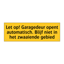 Let op! Garagedeur opent automatisch. Blijf niet in /.../