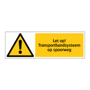Let op! Transportbandsysteem op spoorweg